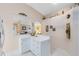 Kitchen featuring white cabinetry and access to an adjoining room at 3661 Kingswood Ct, Clermont, FL 34711