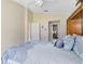 Serene main bedroom featuring an ensuite bathroom, plush bedding, and ample natural light for a peaceful retreat at 3661 Kingswood Ct, Clermont, FL 34711