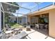 Spacious screened patio with ample seating, perfect for outdoor entertaining at 3661 Kingswood Ct, Clermont, FL 34711
