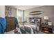 Cozy bedroom featuring surf decor, a comfortable bed, and ample natural light to create a peaceful retreat at 3880 Bluethread Way, Poinciana, FL 34759