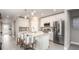 Spacious kitchen with a center island, stainless steel appliances, and open to the living areas at 3880 Bluethread Way, Poinciana, FL 34759