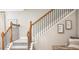 Elegant staircase with neutral carpeting and decorative artwork on the wall at 3880 Bluethread Way, Poinciana, FL 34759
