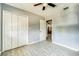 Neutral bedroom featuring tile floors, closet, and neutral colored walls at 409 Lake Ned Rd, Winter Haven, FL 33884