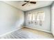 Bedroom features tile flooring, natural light, and neutral colored walls at 409 Lake Ned Rd, Winter Haven, FL 33884