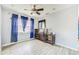 Bedroom features wood look tile flooring, ceiling fan and natural light at 409 Lake Ned Rd, Winter Haven, FL 33884