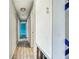 Hallway featuring tile floors and neutral paint at 409 Lake Ned Rd, Winter Haven, FL 33884