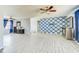 Spacious living room boasting tile floors, a ceiling fan, and open layout for flexible living at 409 Lake Ned Rd, Winter Haven, FL 33884