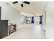 Bright, open living room with new floors, ceiling fan, and lots of natural light at 409 Lake Ned Rd, Winter Haven, FL 33884