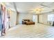 Living Room with light gray walls, a brown sofa and light-colored tile at 409 Lake Ned Rd, Winter Haven, FL 33884