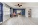 Spacious living room with new flooring and ceiling fan; move-in ready at 409 Lake Ned Rd, Winter Haven, FL 33884