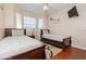 Bright bedroom featuring two twin beds, large windows, and a ceiling fan at 411 Terrace Ridge Cir # 222, Davenport, FL 33896