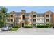 Exterior view of a multi-story building with parking at 411 Terrace Ridge Cir # 222, Davenport, FL 33896