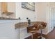 Breakfast bar featuring comfortable seating and modern finishes at 411 Terrace Ridge Cir # 222, Davenport, FL 33896