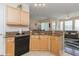 Open kitchen layout with granite countertops and seamless access to the living area at 411 Terrace Ridge Cir # 222, Davenport, FL 33896