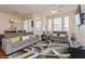 Bright living room featuring plush seating, modern décor, and plenty of natural light at 411 Terrace Ridge Cir # 222, Davenport, FL 33896