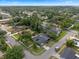 Aerial view of home with a dark roof in a desirable, tree-filled neighborhood at 4118 Teriwood Ave, Orlando, FL 32812