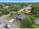 Aerial view of home with a dark roof, mature landscaping, and a pool in a desirable neighborhood at 4118 Teriwood Ave, Orlando, FL 32812