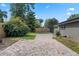 Paver patio in backyard with fence and shrubbery at 4118 Teriwood Ave, Orlando, FL 32812