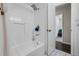Bright bathroom featuring a shower-over-tub and white tile at 4118 Teriwood Ave, Orlando, FL 32812