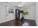 A bedroom featuring an exercise bike with hardwood floors and a ceiling fan and natural light at 4118 Teriwood Ave, Orlando, FL 32812