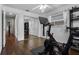 A bedroom featuring an exercise bike with hardwood floors and a ceiling fan and natural light at 4118 Teriwood Ave, Orlando, FL 32812