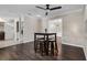 Inviting dining area featuring modern lighting, dark wood floors, and seamless flow to the living spaces at 4118 Teriwood Ave, Orlando, FL 32812