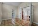 Inviting entry room with terracotta tile flooring and double doors leading into an adjacent bedroom at 4118 Teriwood Ave, Orlando, FL 32812