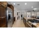 Modern kitchen boasts dark wood cabinets, stainless steel appliances, and spacious countertops at 4118 Teriwood Ave, Orlando, FL 32812