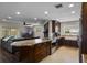 Open-concept kitchen with granite countertops, stainless appliances, and dark wood cabinets adjacent to the living room at 4118 Teriwood Ave, Orlando, FL 32812