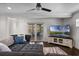 Comfortable living room features a cozy sectional sofa, ceiling fan, and sliding glass doors to the patio at 4118 Teriwood Ave, Orlando, FL 32812
