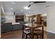 Open living area features dark wood floors, views of the kitchen, and an inviting atmosphere at 4118 Teriwood Ave, Orlando, FL 32812