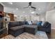 Spacious living area with a large sectional sofa, fireplace, and an open view to the kitchen at 4118 Teriwood Ave, Orlando, FL 32812