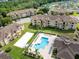 Aerial view of the pool and volleyball court located next to the condo buildings at 422 Terrace Ridge Cir # 422, Davenport, FL 33896