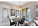 Dining area with a sliding glass door leading to a patio and views of the outside at 422 Terrace Ridge Cir # 422, Davenport, FL 33896