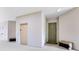 The hallway features neutral walls, with building access doors, and neutral flooring at 422 Terrace Ridge Cir # 422, Davenport, FL 33896