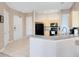 Bright kitchen featuring tile floors, black appliances, and a breakfast bar with ample counter space at 422 Terrace Ridge Cir # 422, Davenport, FL 33896