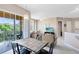 Bright and open living space with a dining area, sliding glass doors to a balcony, and comfortable furnishings at 422 Terrace Ridge Cir # 422, Davenport, FL 33896