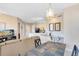 Cozy living room with a dining area and a partial view into the kitchen at 422 Terrace Ridge Cir # 422, Davenport, FL 33896