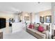 Open floor plan combining the living area and kitchen, featuring modern appliances and comfortable seating at 422 Terrace Ridge Cir # 422, Davenport, FL 33896