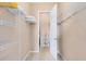 Walk-in closet with shelving units and ample storage space at 422 Terrace Ridge Cir # 422, Davenport, FL 33896