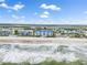 Aerial perspective of community with beach access, coastal buildings, and ocean view at 4601 S Atlantic Ave # 7030, Port Orange, FL 32127