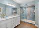 Elegant bathroom featuring double vanity and glass enclosed shower with designer tile at 4601 S Atlantic Ave # 7030, Port Orange, FL 32127