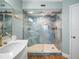 Modern bathroom with glass enclosed shower with designer tile and ample lighting at 4601 S Atlantic Ave # 7030, Port Orange, FL 32127