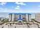 Coastal condo building with a blue roof, showcasing beach access and convenient parking at 4601 S Atlantic Ave # 7030, Port Orange, FL 32127