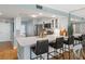 Modern kitchen featuring white cabinetry, stainless steel appliances, and a breakfast bar at 4601 S Atlantic Ave # 7030, Port Orange, FL 32127