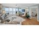 Bright living room with ocean views and comfortable seating in this luxurious condo at 4601 S Atlantic Ave # 7030, Port Orange, FL 32127