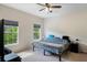 Bright and airy bedroom with two windows, neutral carpet, and a comfortable queen-size bed at 4725 Anson Ln, Orlando, FL 32814