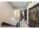 Second story hallway featuring brown doors and access to other rooms within the house at 4725 Anson Ln, Orlando, FL 32814