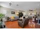 Spacious living room with hardwood floors, comfortable seating, and ample natural light at 4725 Anson Ln, Orlando, FL 32814