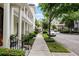 Charming street view of townhomes with lovely porches, pillars and sidewalks at 4725 Anson Ln, Orlando, FL 32814